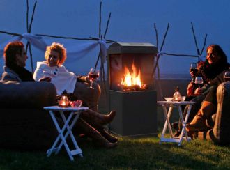 People sitting around a Buzz Faber Fire