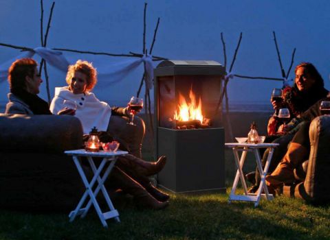 People sitting around a Buzz Faber Fire