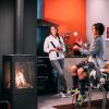 Mother and son in kitchen next to a fire